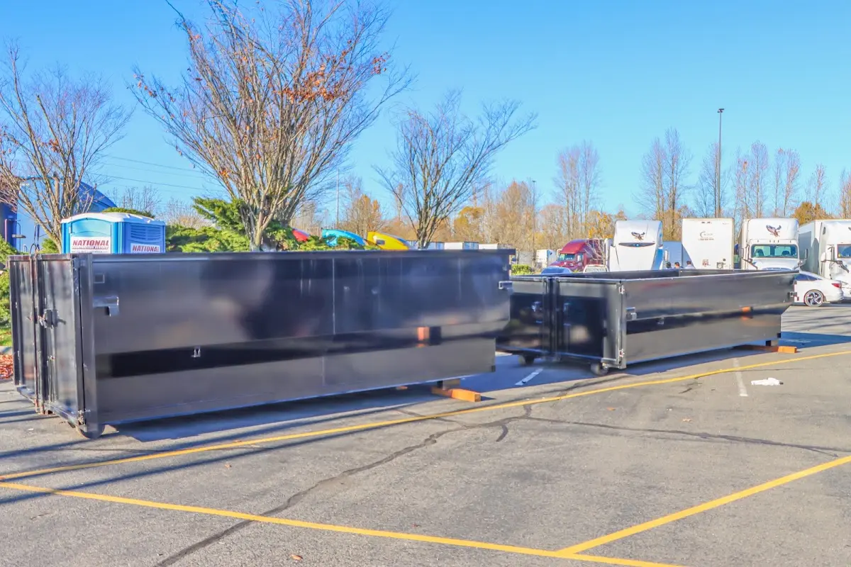 Professional dumpster rental service with roll-off container on residential driveway in Wildomar